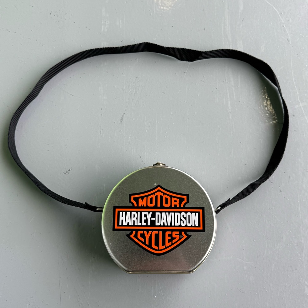 1999 Harley-Davidson Silver and Black tin bag/lunch box with Orange Logo